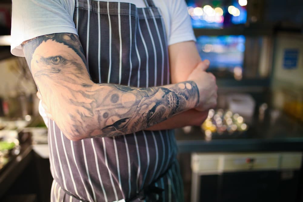 Jobs in Brighton - chef with a tattoo at the Chilli pIckle