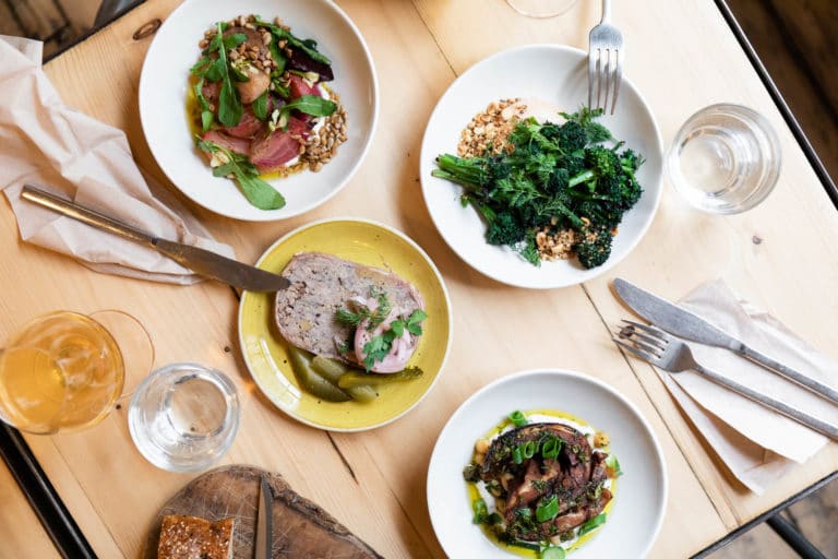 Four different food plates served on table