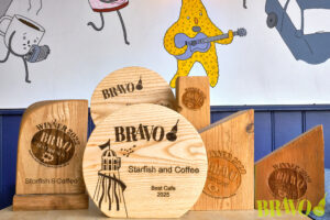 Multiple BRAVO winning trophies on a table at Starfish and Coffee