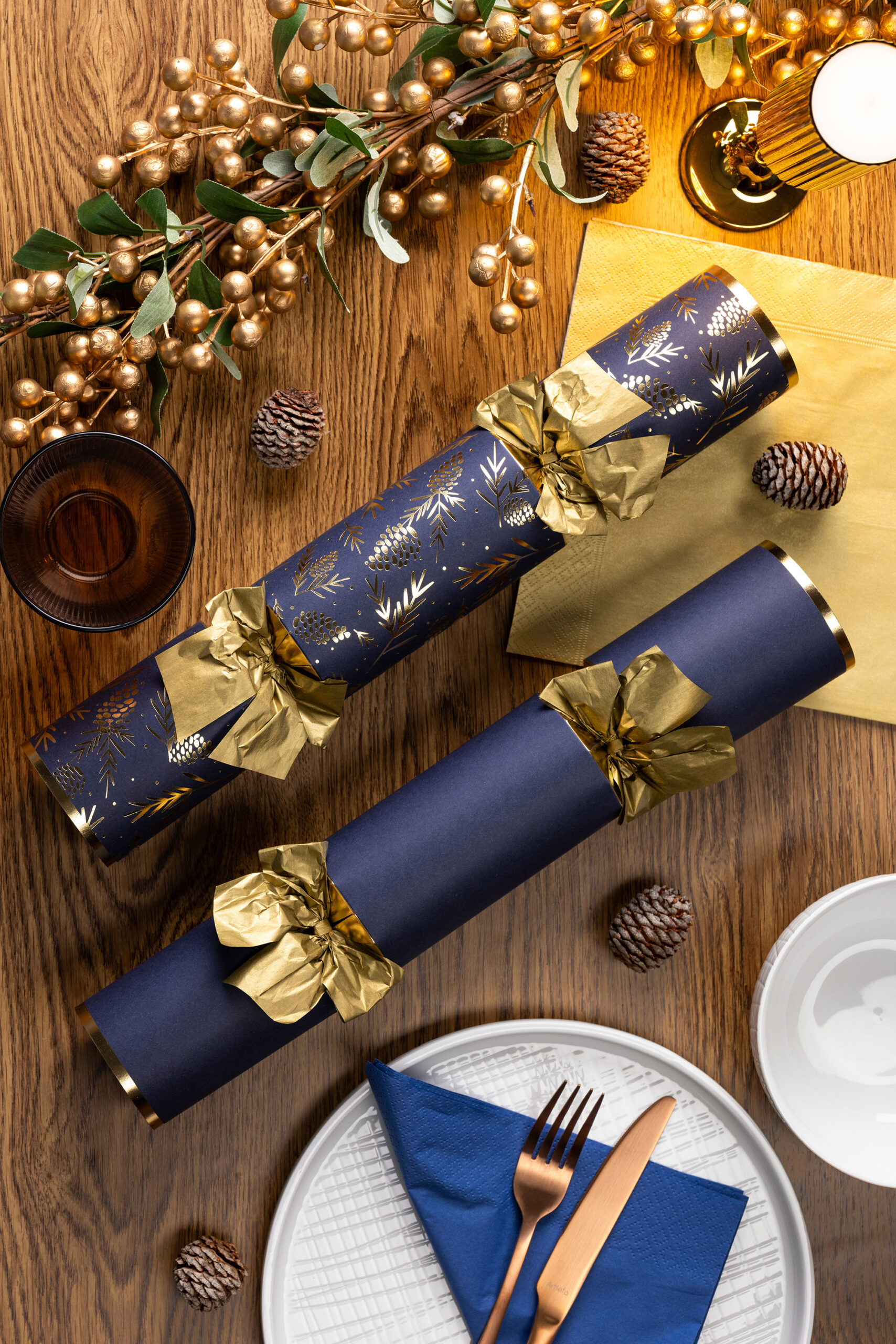 This year, navy is stealing the spotlight as a sophisticated alternative to classic Christmas reds and greens. Whether used in crackers or bauble sets, this deep, rich tone instantly adds depth and elegance to a festive setting. Navy pairs beautifully with metallic accents like gold and silver, making it versatile for both contemporary and traditional interiors. Think navy crackers offset by crisp white linens for a high impact yet timeless look. 