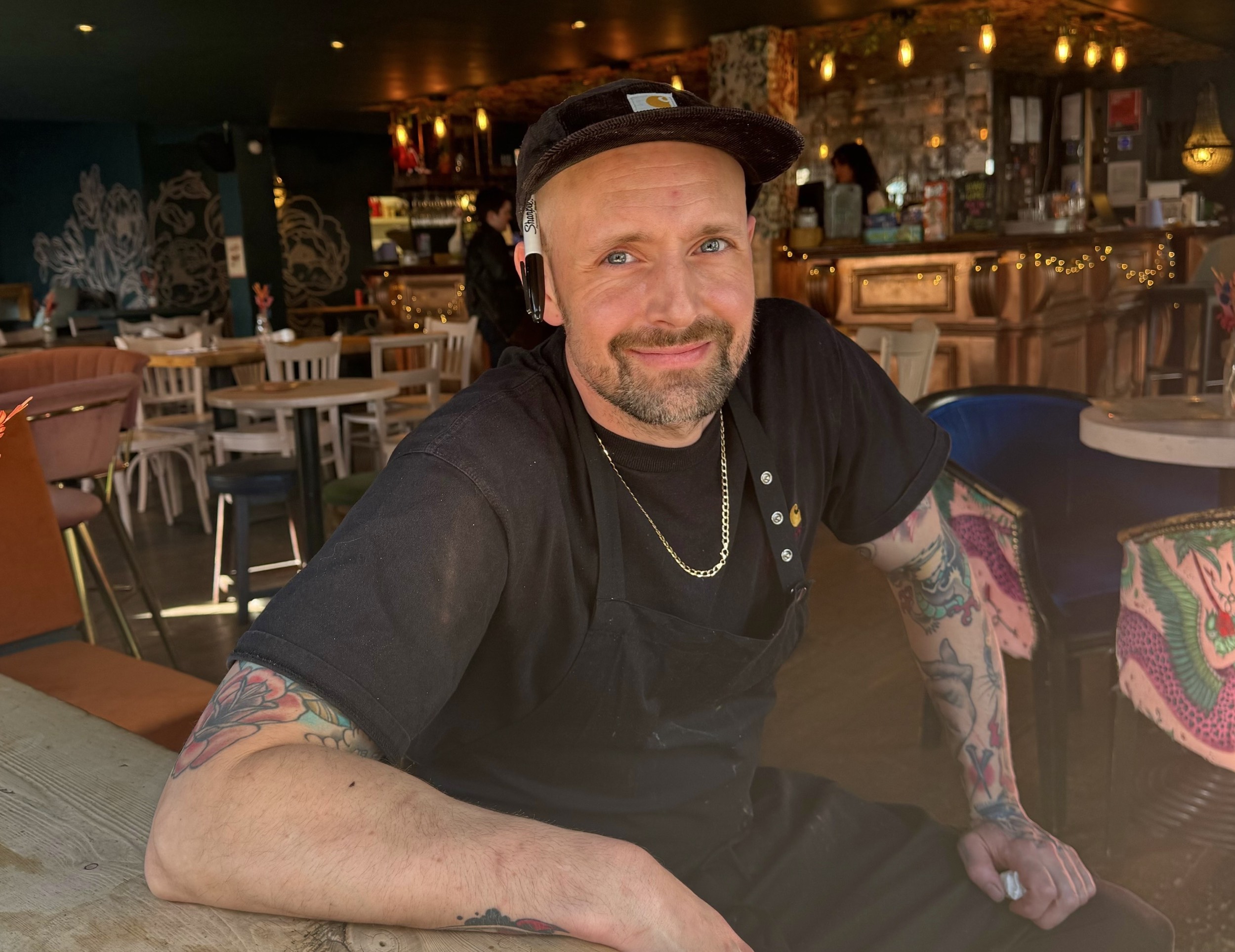 Chef Nick Wood sitting inside The Fountain Head Pub in Brighton. Nick is the founder of Boysterous Burgers