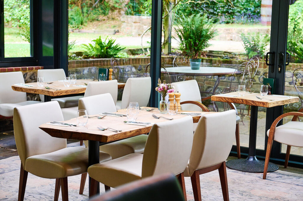 Interior of the conservatory at The Jolly Sportsman, Sussex pub.