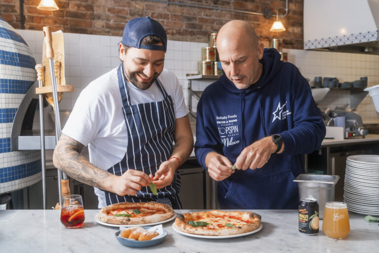 Fatto a Mano owner and chef tasting pizzas in the restaurant.