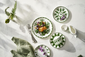 Maximalist and Whimsical crockery by Alliance South East. white and green plates on a white table cloth