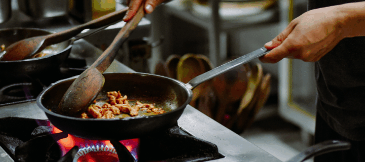 head chef position, chef cooking meat in the pan