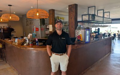 Ashley Saunter standing at a bar. Toast POS.