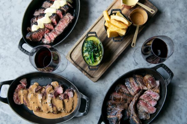 table laid out with meat dishes