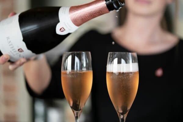 two glasses being poured with rathfinny wine