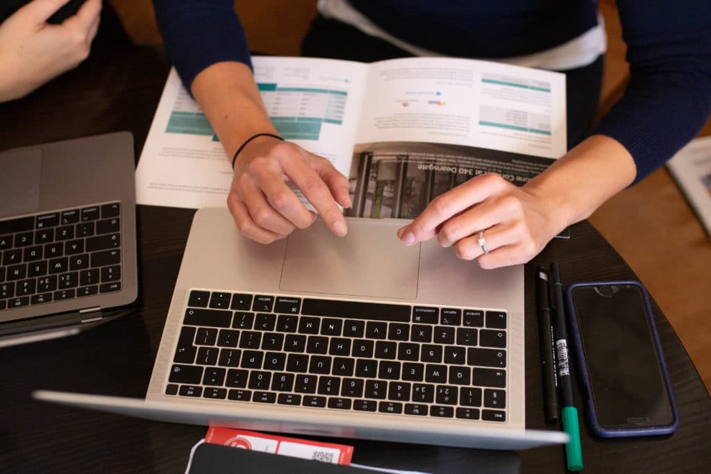 typing at a laptop