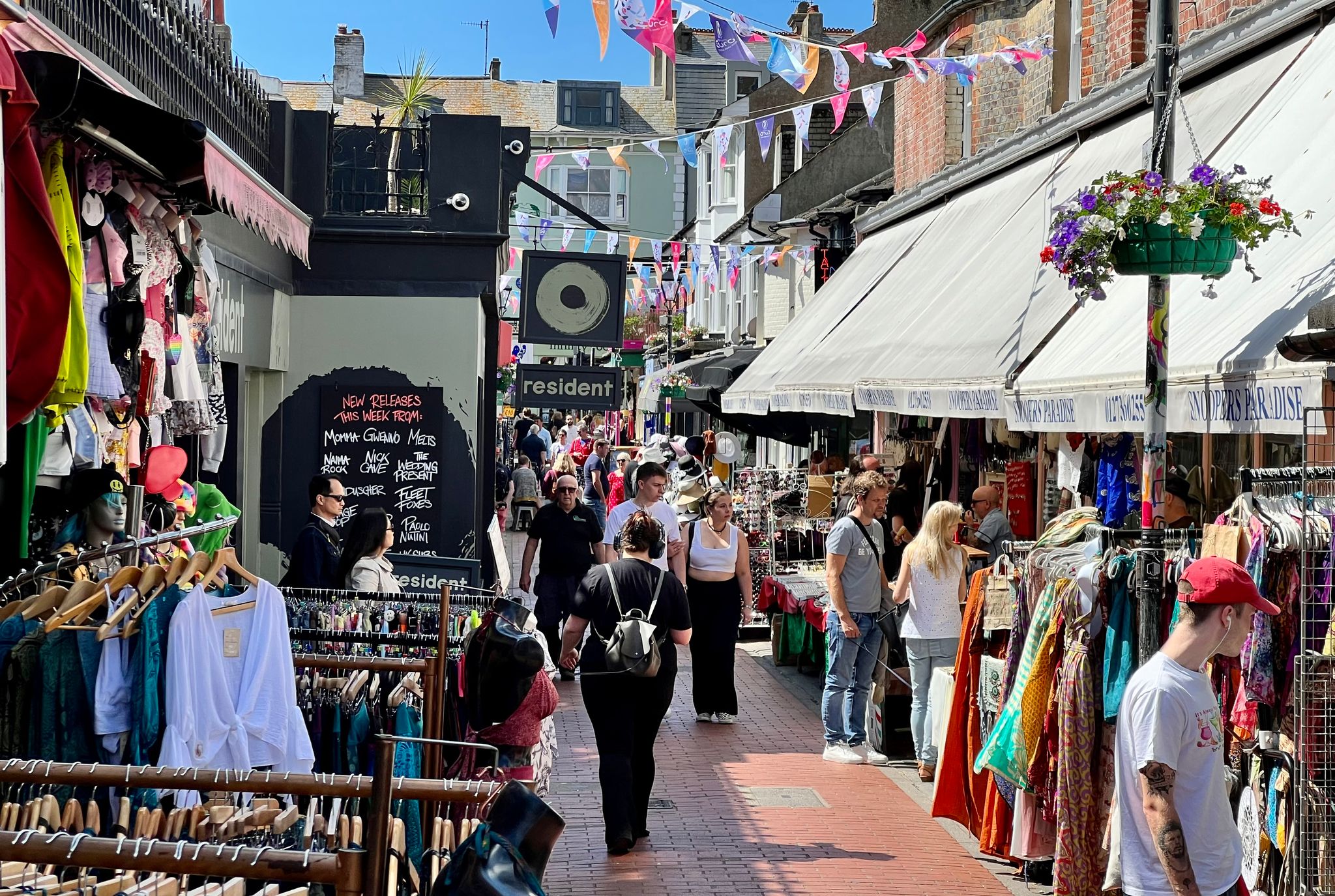 lovely shot of the North Laine, people walking on the street and looking at different shops