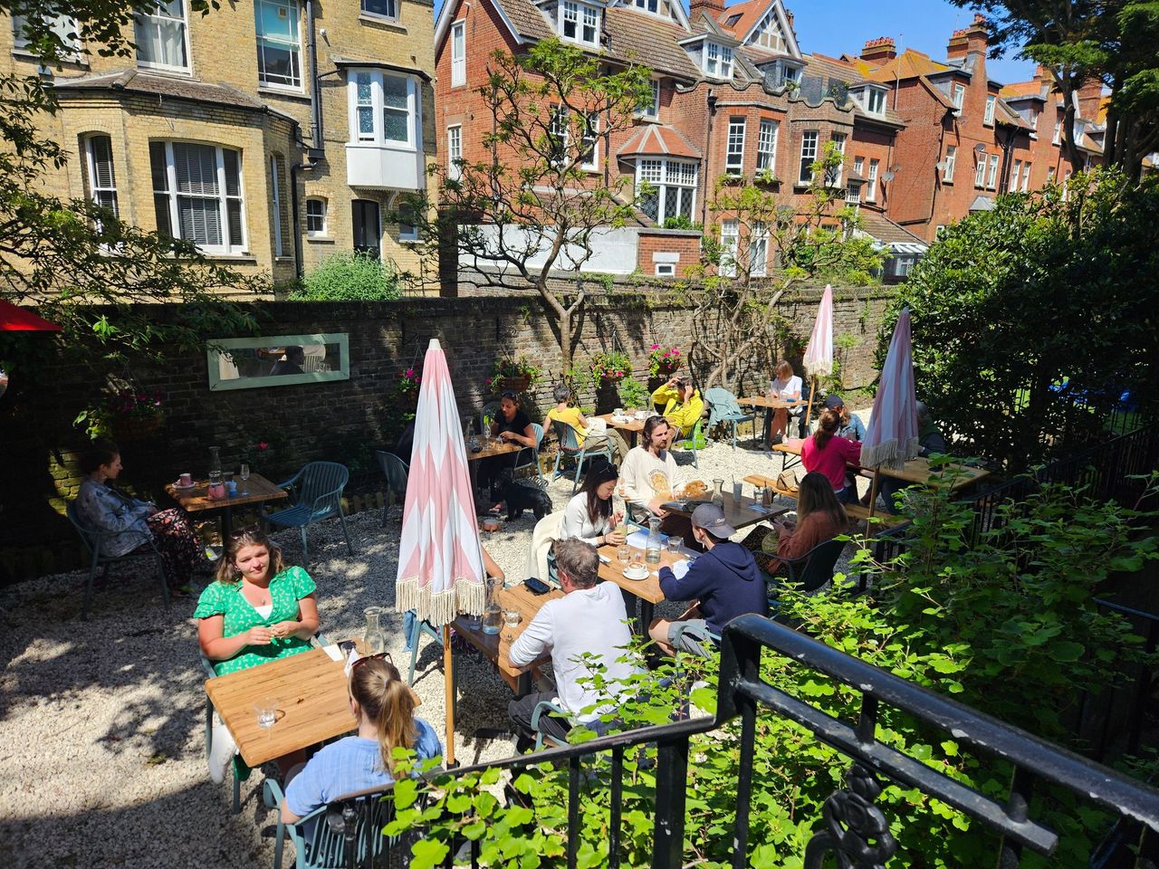 beautiful Oeuf garden populated with people on a sunny day