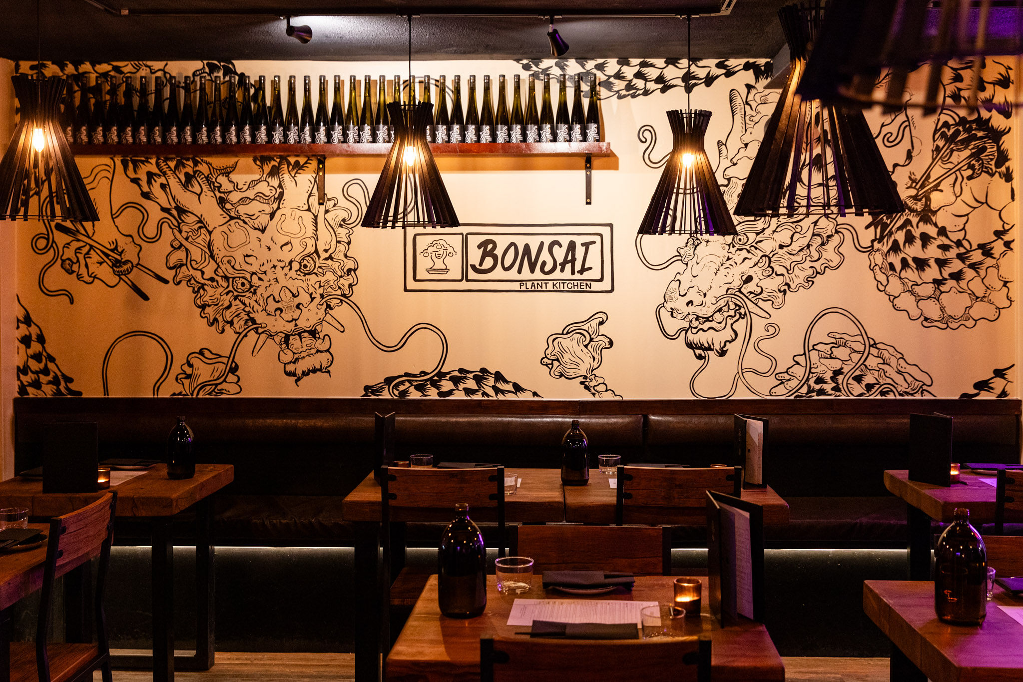 Interiors of vegan restaurant in Brighton with wall art