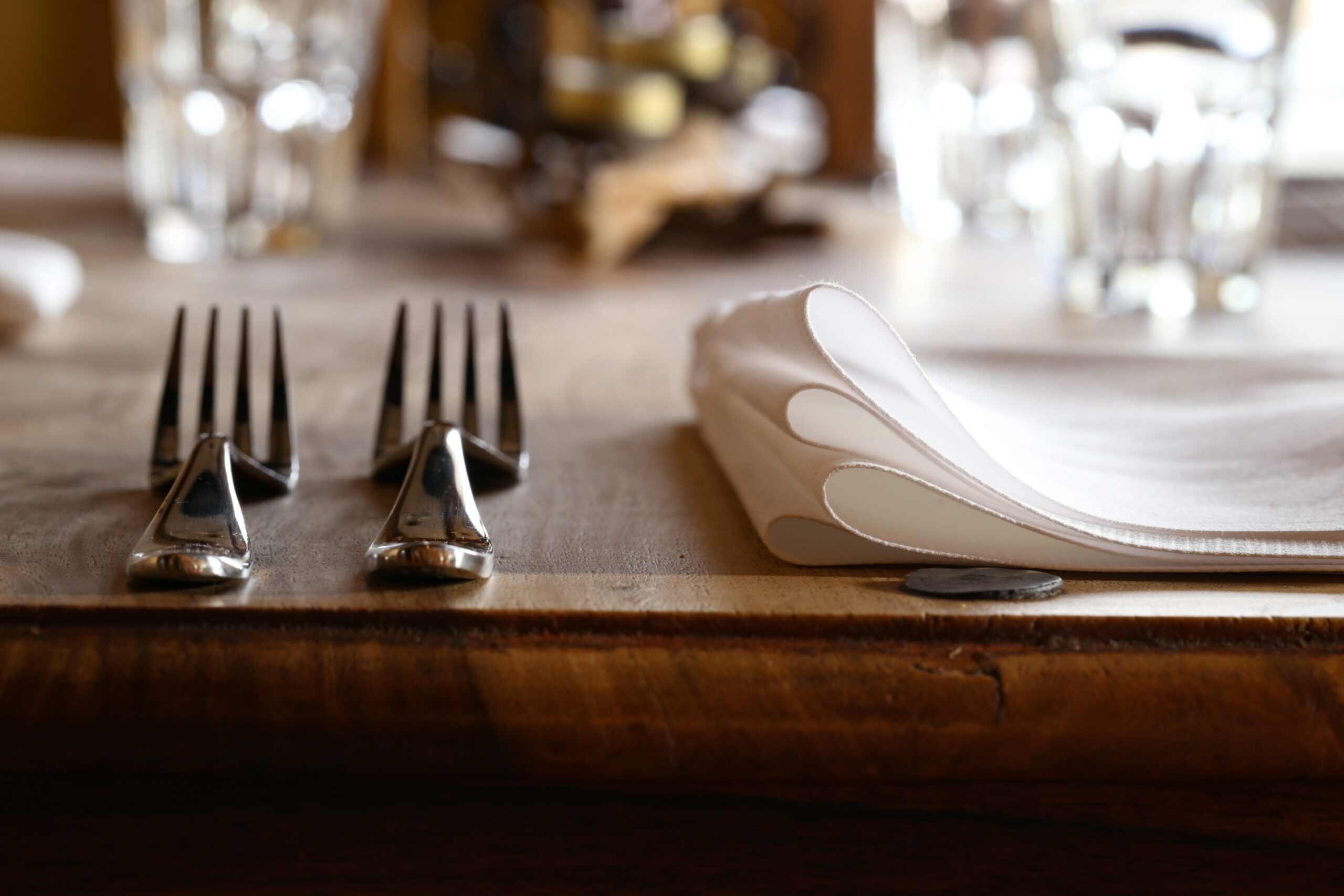 two forks on the wooden table