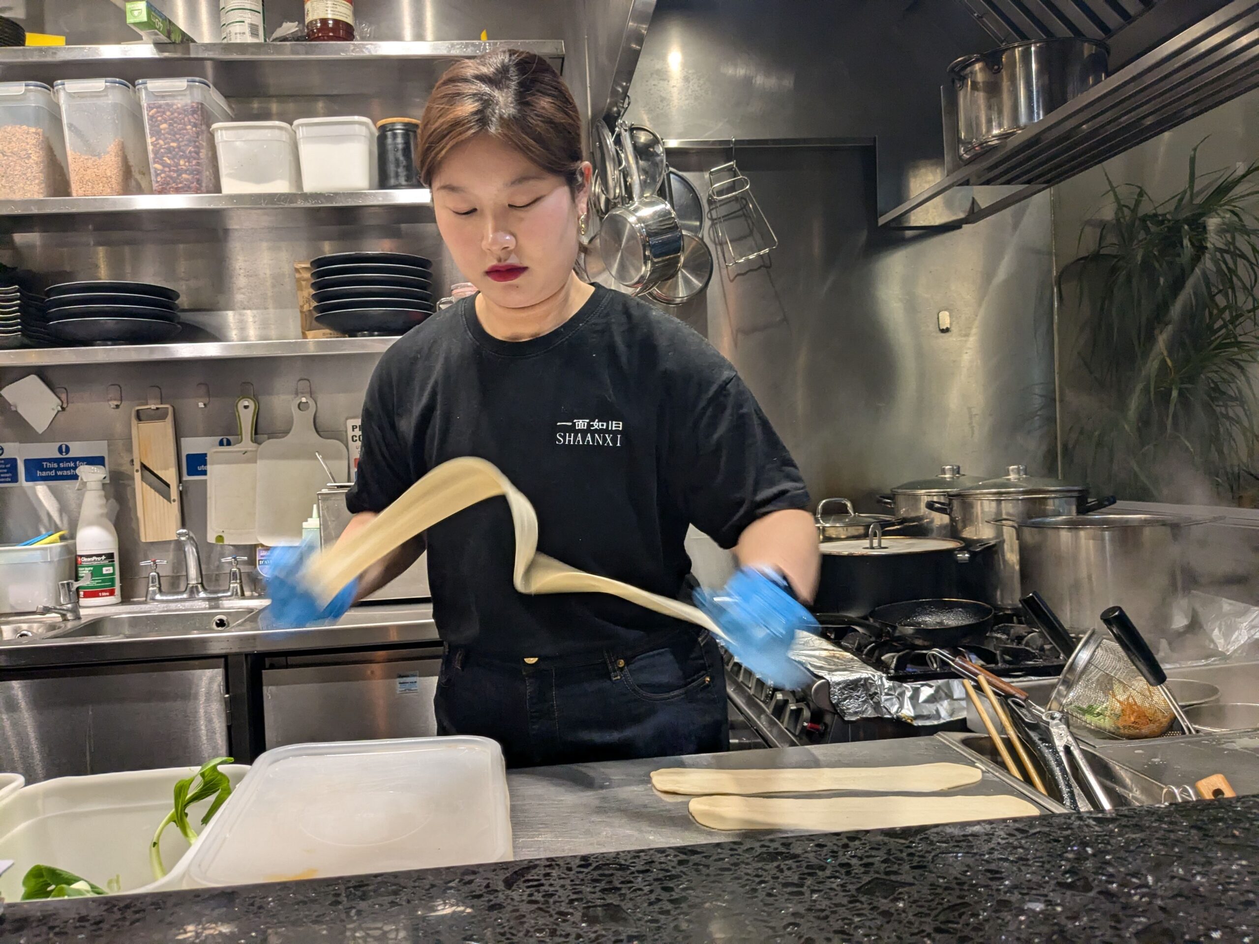 Shaanxi, lady chef making biang biang noodles