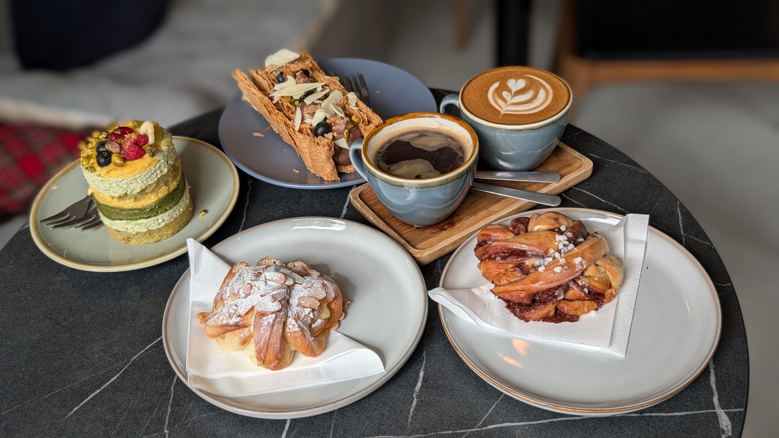Photo of two coffees, two pasties and two cakes at jacob's Bakery