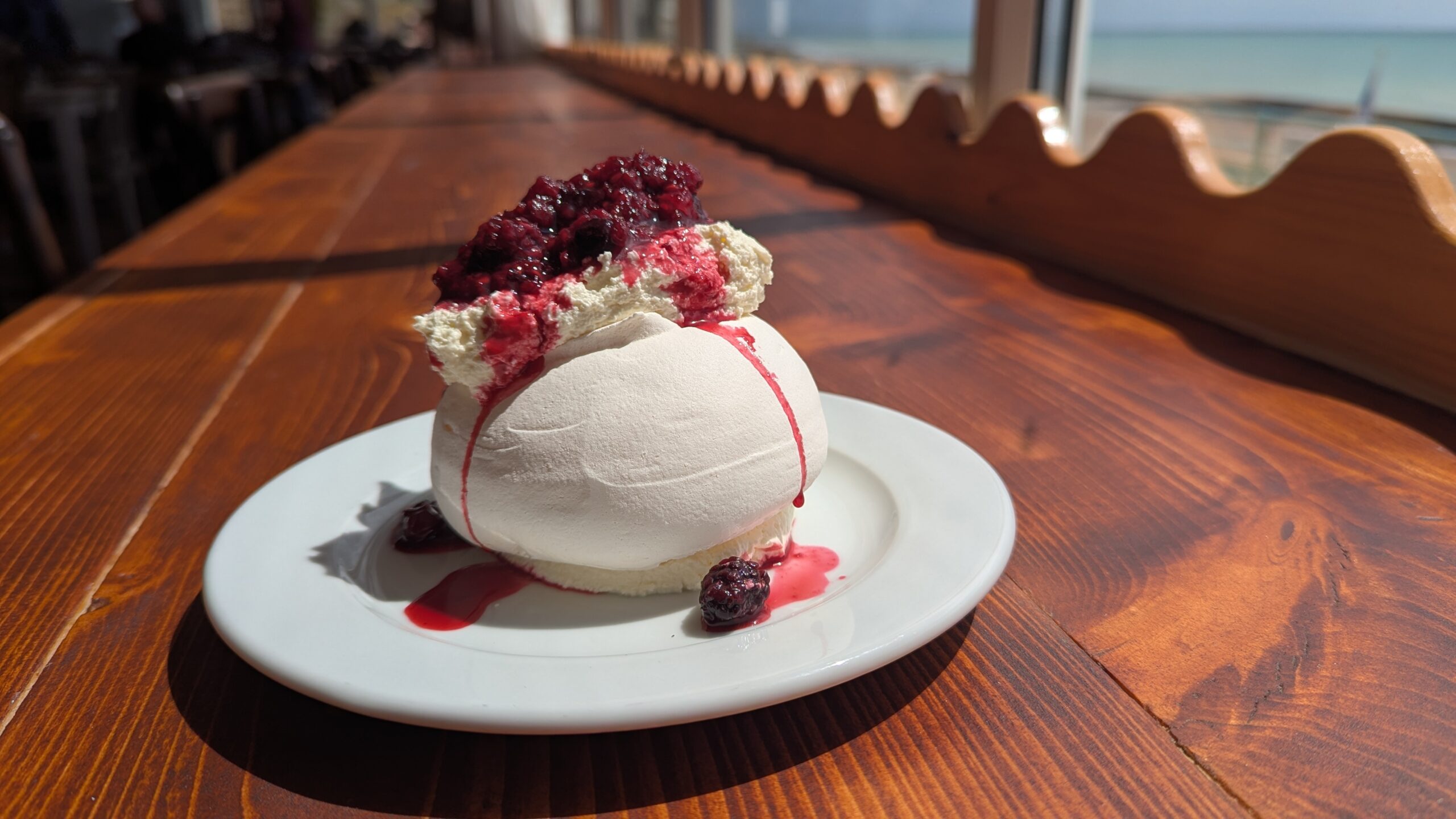 Ice cream dessert served on the white plate at Kitti's Saltdean