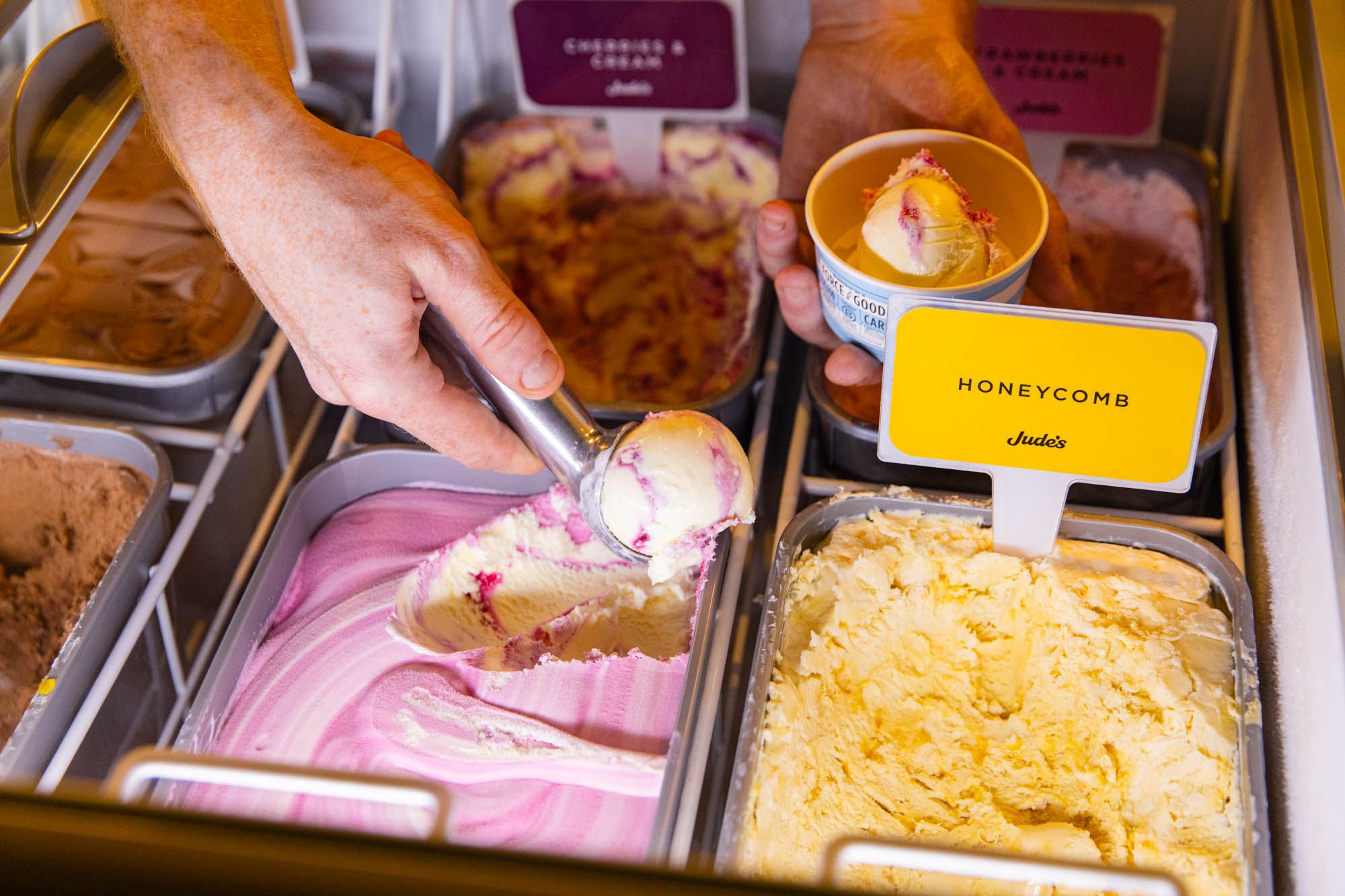 hand scooping ice cream 