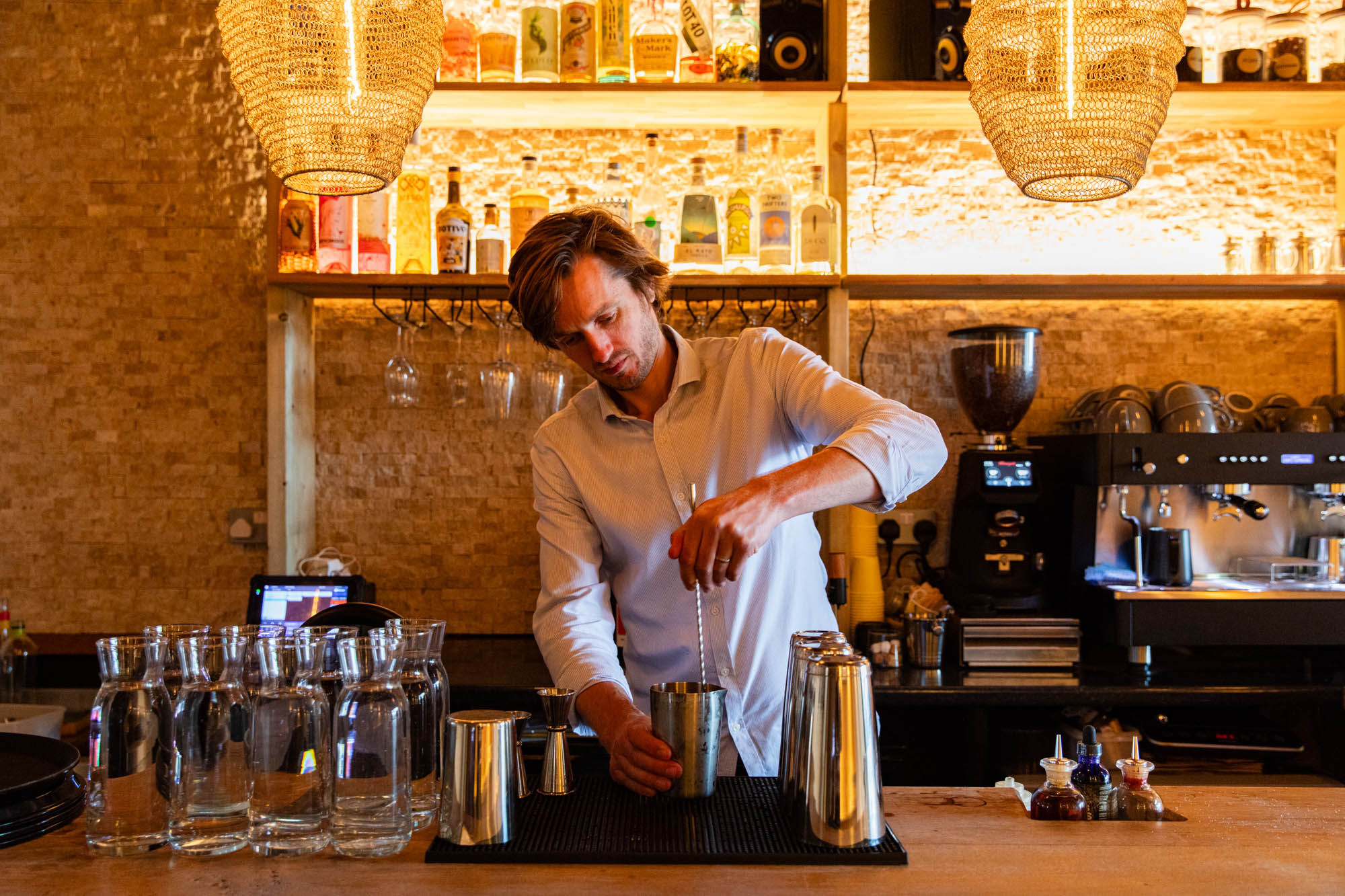 Alistare preparing a drink at APiary