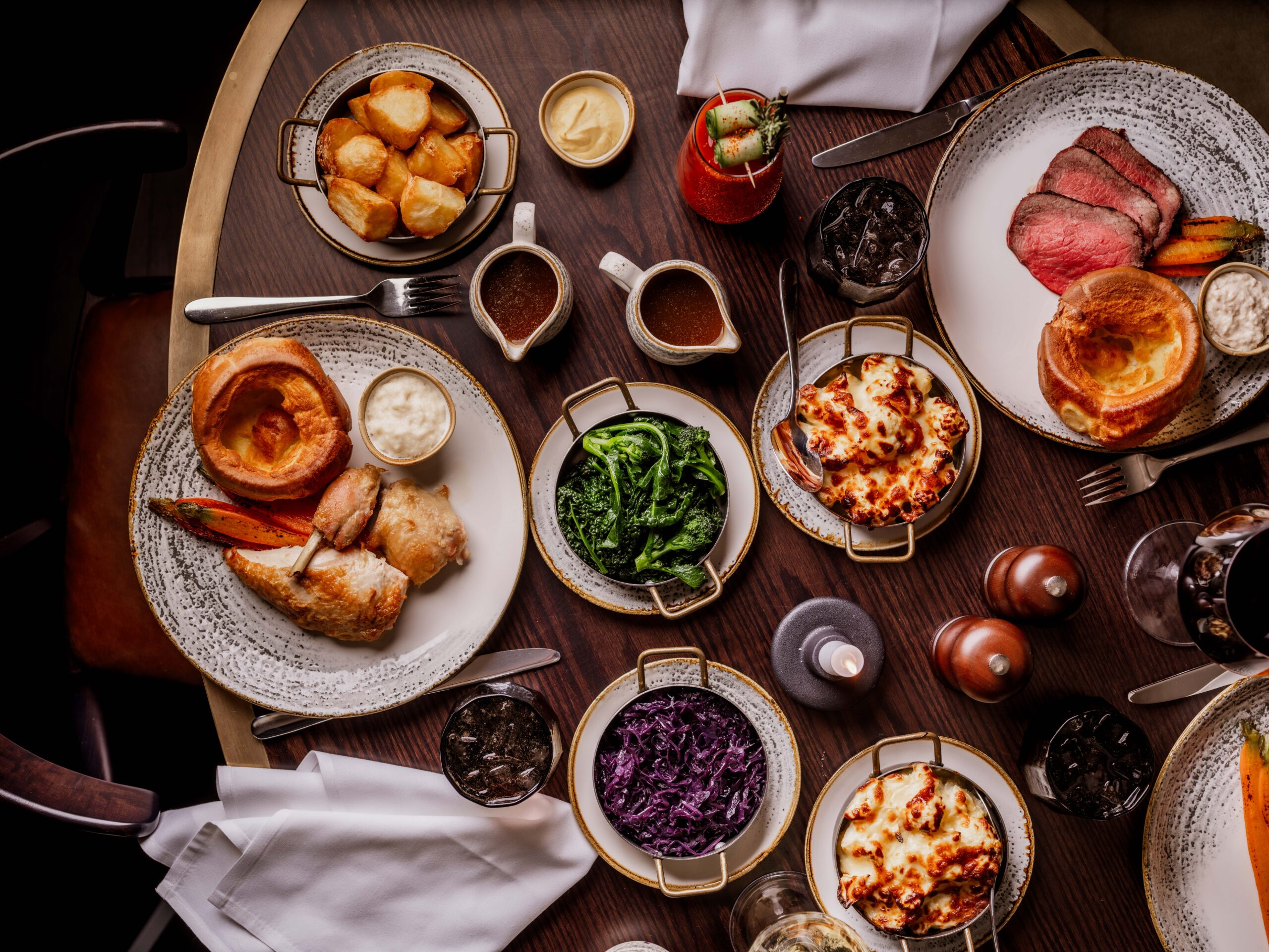 Table laden with different dishes shot from above