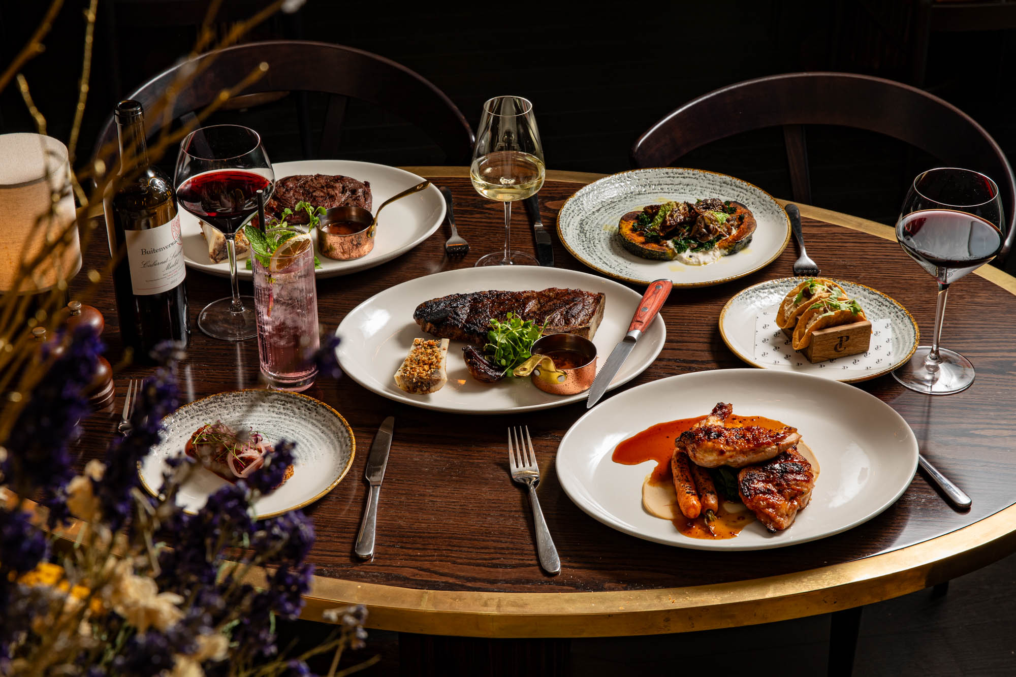 a table laden with many plates of food