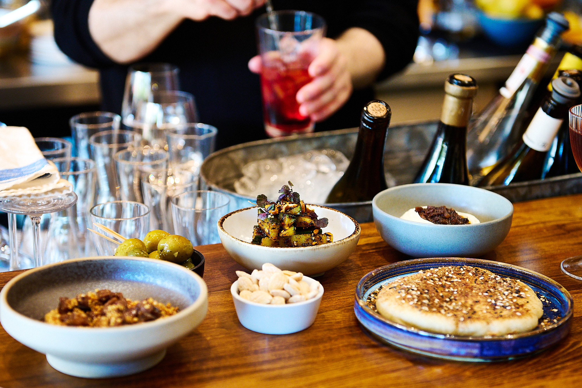 close up shot of the table populated with small plates at Fouth and Church