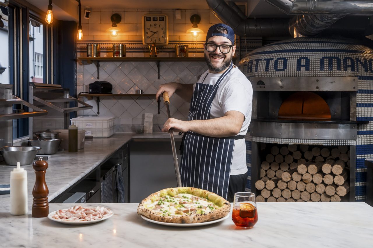 Fatto A Mano chef preparing pizza