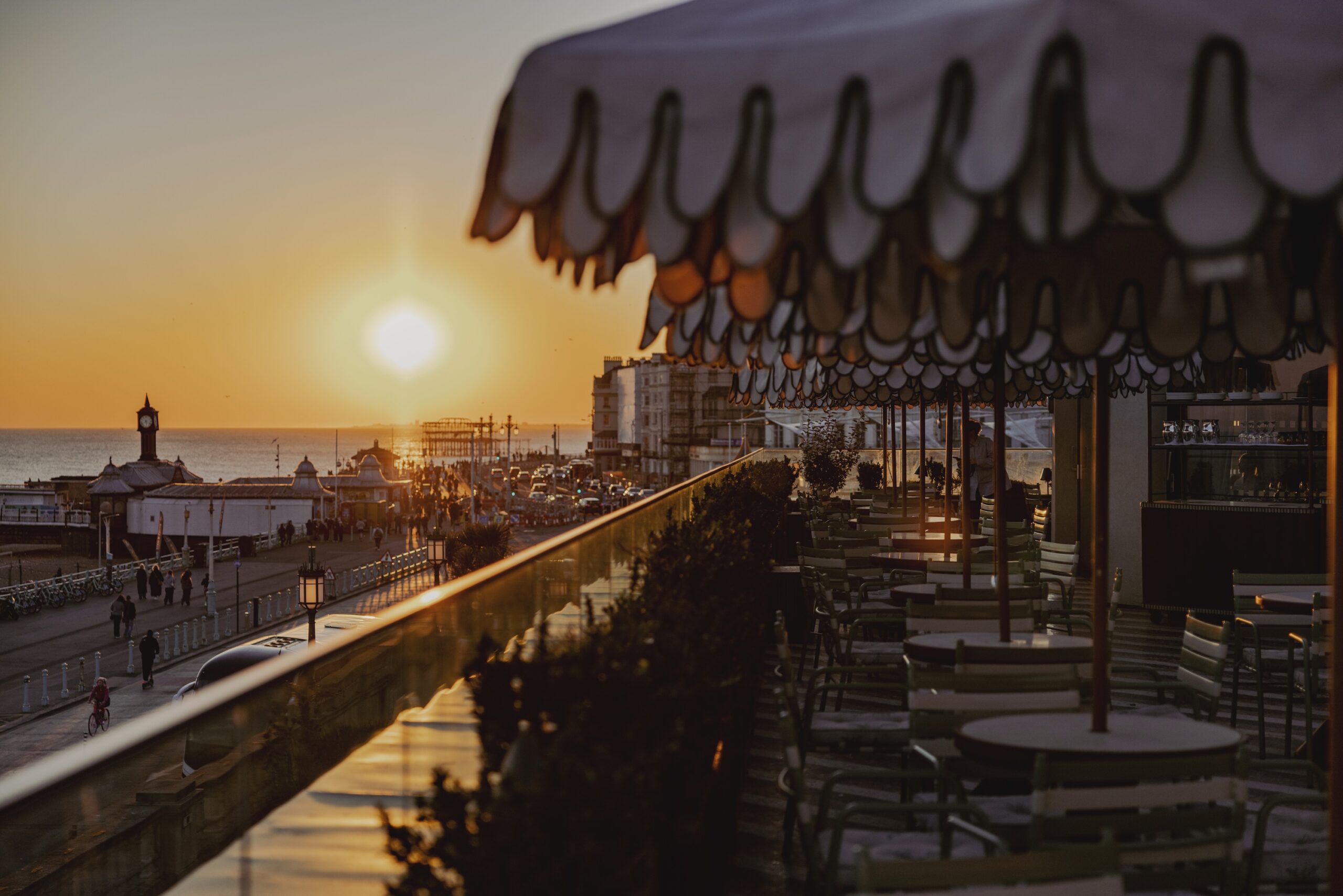 sunset views facing West from Cecconi's Italian restaurant on Brighton's seafront. Things to do in Brighton